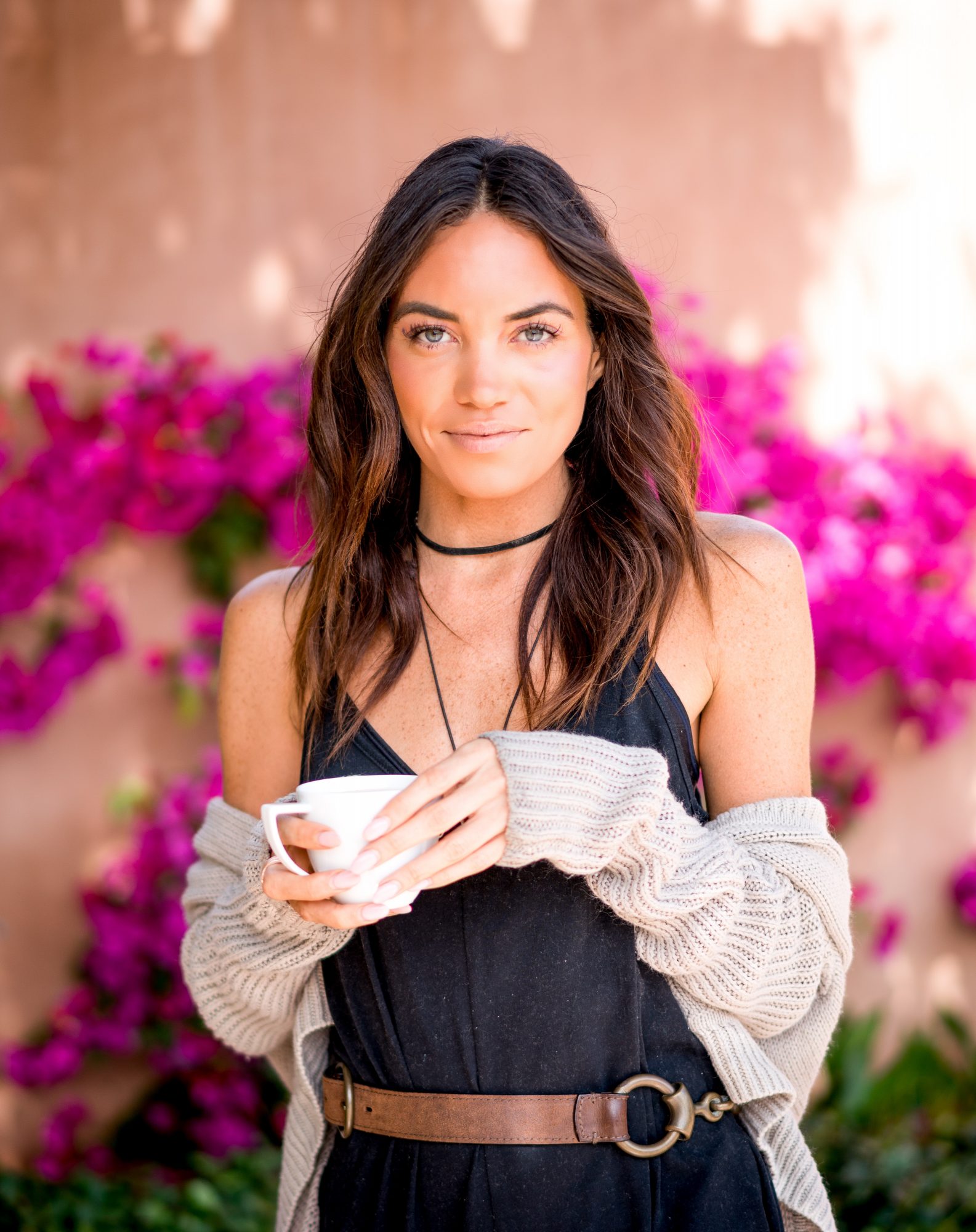 tara mackey drinks cbd tea in front of purple flowers in encinitas california shot with sony a7rii and sony 55 1.8 | photo by jake landon schwartz