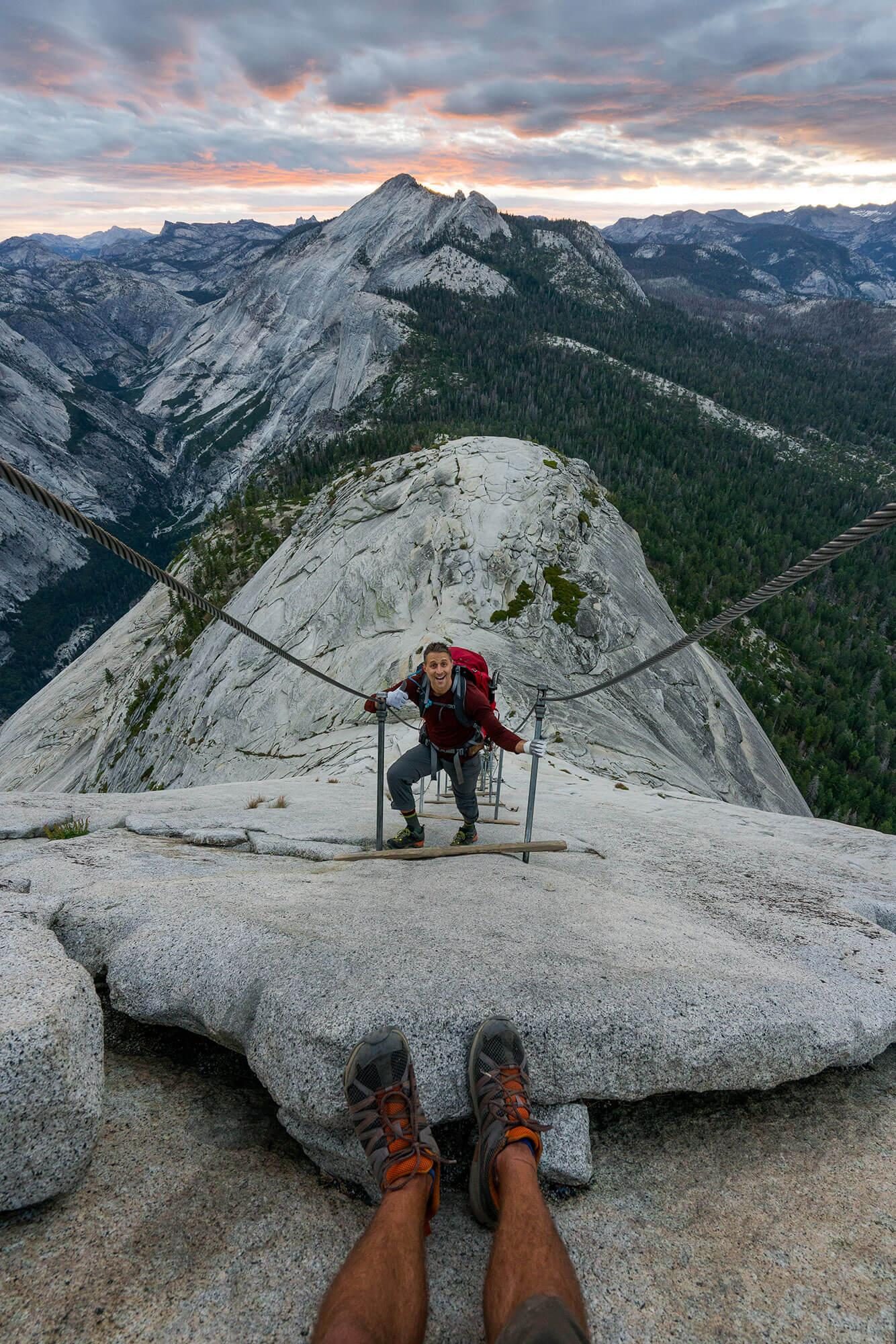 view of sunrise from the half dome cables in yosemite national park | photo by jake landon schwartz