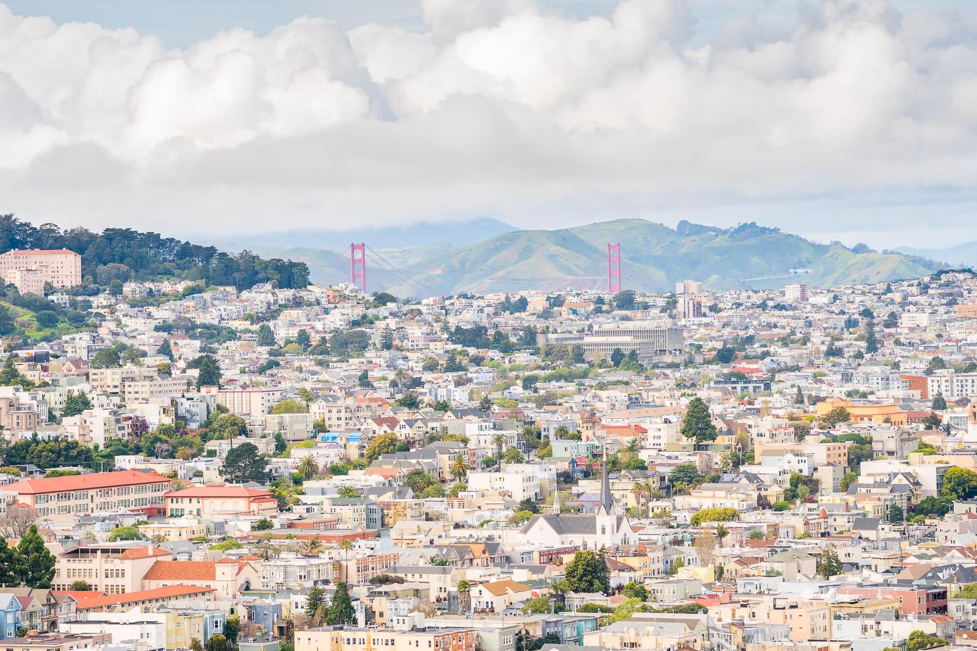 a view of the golden gate bridge behind the sprawl of san francisco as seen from bernal heights | photo by jake landon schwartz