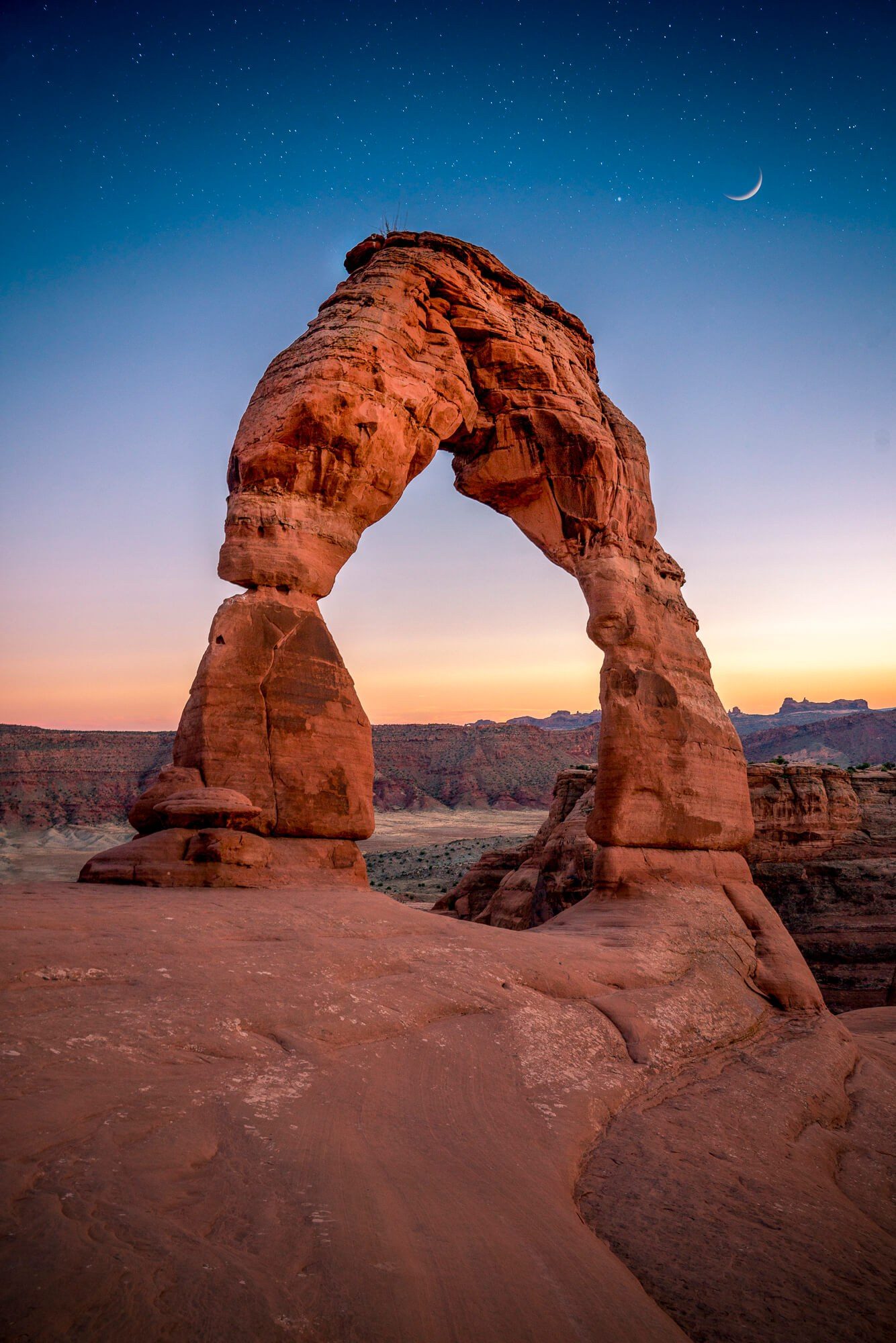 Delicate Arch after sunset in Arches National Park, Utah by Jake Landon Schwartz | photo by jake landon schwartz