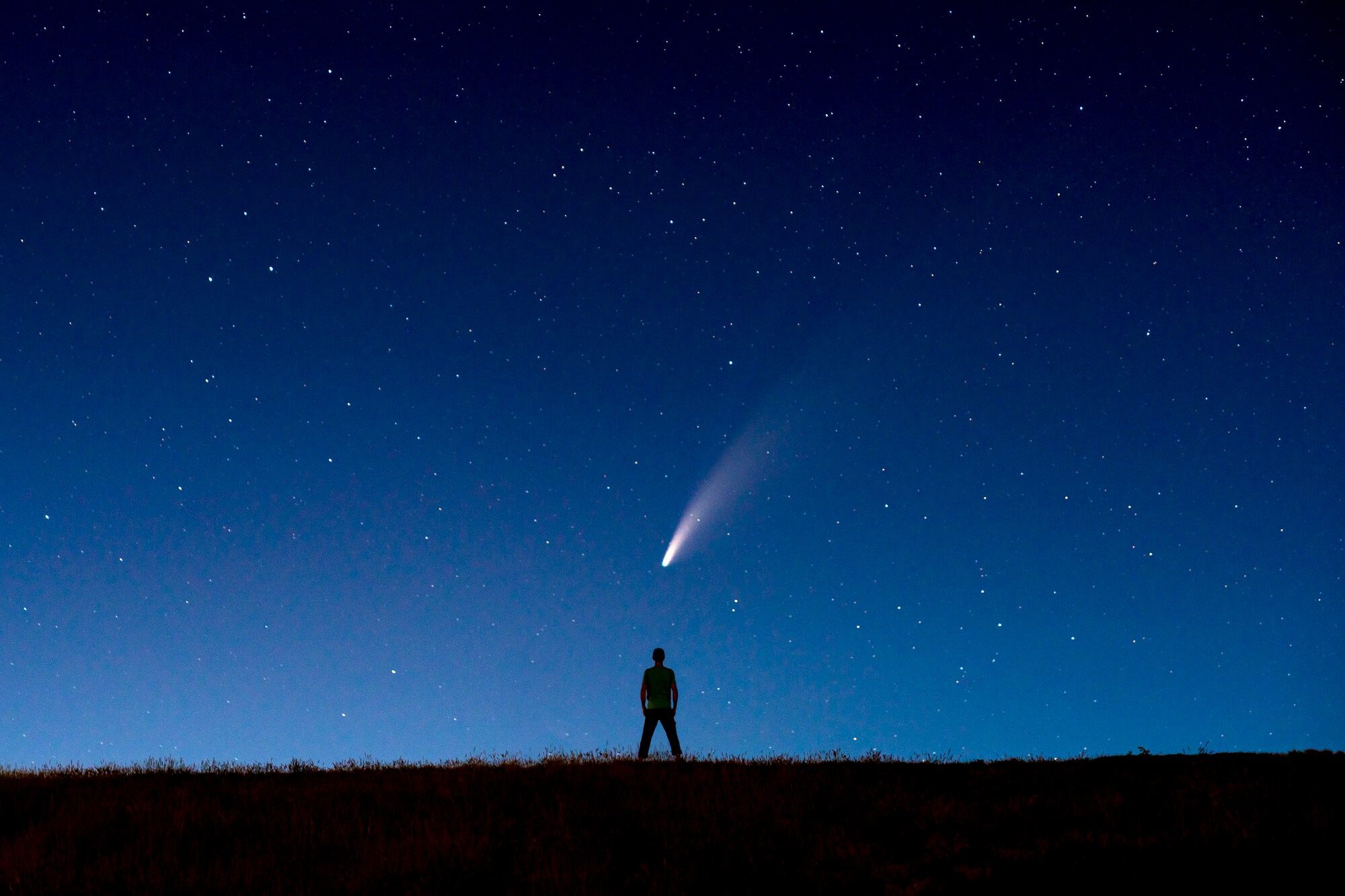 Herman Austin Watson IV standing under the comet in July, 2020 in Bozeman, MT by Jake Landon Schwartz | photo by jake landon schwartz